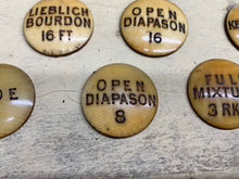 Load image into Gallery viewer, 13 ANTIQUE ORGAN STOP FACES, LABELS 1 1/4 IN DIAMETER - Boyshill Tools and Treen